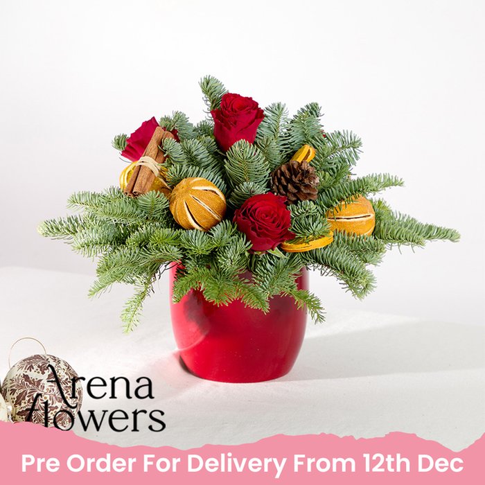 Christmas Table Arrangement by Arena Flowers