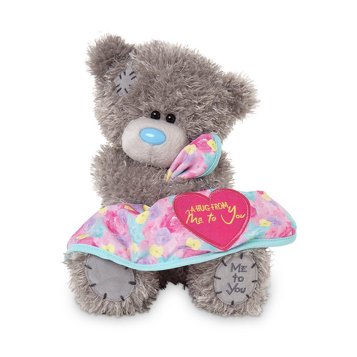 Tatty Holding a 'Hug from Me to You' Blanket