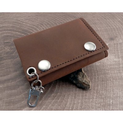 With two snap closure; with hook for easy attachment of wallet chains or clip ons; measures approximately 3" x 4 1/4 "