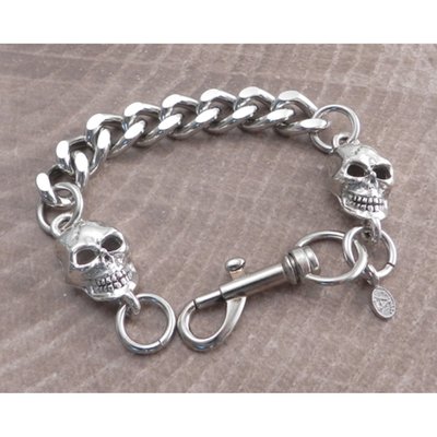 Silver; made to fit an 8" wrist; heavyweight chain with cut links and a skull on each end; chrome-plated steel; with Snap Hook closure; chain links 3/4" lenght by 1/2" width