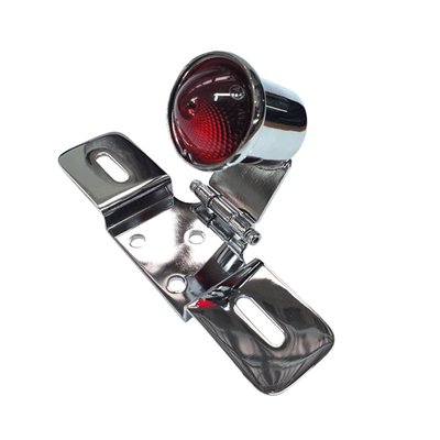 Perfect solution for the early look with modern day lighting dependability and legality.
The license plate bracket and license plate bracket connection is hinged. This allows the taillight to be angled forward or backwards, to compensate for the mounting angle on the rear fender.
- Chrome metal body
- With license plate bracket
- Can be adjusted for correct angle
- Red lens
- ECE approved lens
- Approx. body dimensions: 30mm body diameter x 45mm body length.
- Approx license plate bracket dimensions: 177mm wide x 28mm high.