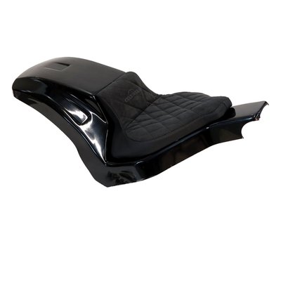 Unpainted gloss black finished ABS. Perfect for installing a wider, up to 280 series, rear tire. Comes with a steel inner fender carrier, a sturdy 5-axis CNC machined ABS outer fender and a genuine leather seat. After the stock fender is removed the Racing steel fender is simply installed on the stock mounting points. Then wiring is installed and ABS outer fender is bolted to the inner fender. Permanent mods are not required. Complete with LED taillight, LED turn signals, seat and hardware. This comes with approval. 
Parts include: 
- ABS plastic rear fender 
- Metal inner fender 
- Wiring harness including lighting for "plug and play" connection 
- Genuine leather seat and pillion pad (depending on selection) 
- Mounting material 
- 2x spring travel limiters. 
Note: Image shows a 280 series tire on a widened rim. 
Note: A load equalizer may be required to correct turn signal flashing speed.
Note: Check your local MCS dealer or the MCS sales department for exact type of approval and validity on bike model and years on the test report.