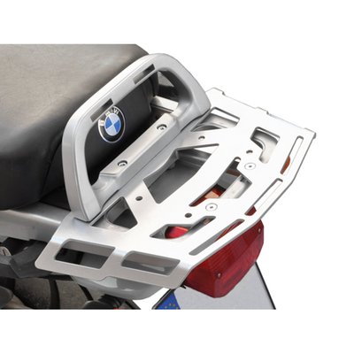 This silver powdercoated luggage rack is made from 4mm thick and laser cut aluminum. It can be mounted to the original support plate to enlarge the rack's surface area. The slots for the fastening straps secure the luggage directly on the luggage rack. 
