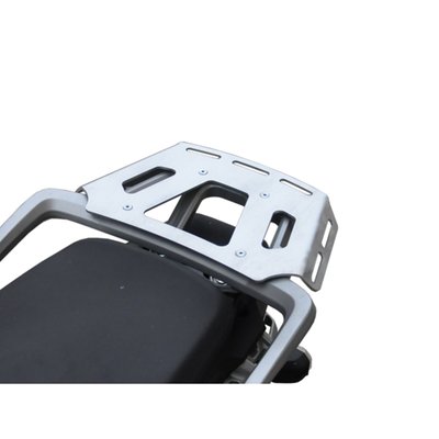 This silver powdercoated luggage rack is made from 4mm thick and laser cut aluminum. It can be mounted to the original support plate to enlarge the rack's surface area. The slots for the fastening straps secure the luggage directly on the luggage rack. 