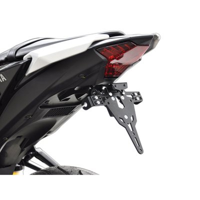 Black powder coated license plate bracket that allows installation without making changes to the fairing parts. Use with 175mm wide license plate (Germany, France, Italy). Including LED license plate light (ECE approved)