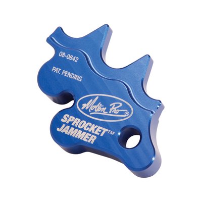 Placed between chain and sprocket where it prevents the wheel, chain and sprockets from rotation. A great help for any job where the wheel may not rotate. Can also be used to pull the wheel to the rear against the chain tensioners before tightening the rear wheel axle. Lightweight CNC machined billet aluminum construction for use in the field or at home/shop.