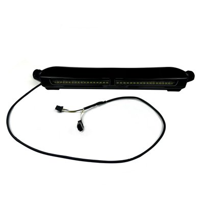 Gloss black. Two banks of 18 bright white LEDs set behind a smooth smoked lens to add forward visibility to the front, lower edge of the OEM windshield on 2015-style Road Glide models. Durable metal housing attaches to the windshield and is equipped with plug and play connectors for installation. 
Note: See 700693 for matching windshield trim with auxiliary turn signals. 