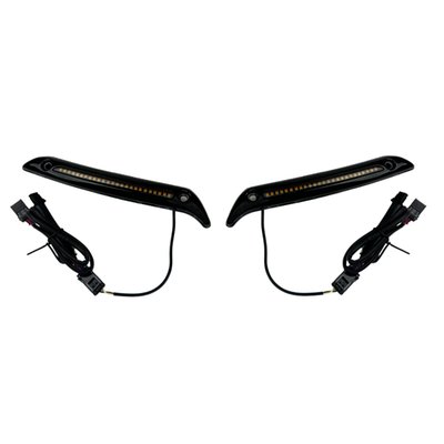 This windshield DRL/turn signal trim is installed to the lower side of the windshield, to the fairing body. Comes as a low profile metal housing, which hold a single row of dual color LEDs behind a smoked lens. 
Offers bright white DRL and full contrast, customizable amber turn signals. Select one of three built-in turn signal modes by using the provided magnet. Turn signals can be set to flash solid on, sequential on (LEDs turn on from center of the bike, outwards) or sequential off (all LEDs on, then turn off from center of the bike, outwards). Extended wire leads plug in under the fairing for easy installation.