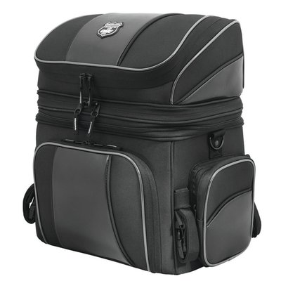 Industry leading UltraMax® fabric for maximum UV protection.
- Mounts to luggage rack, sissy bar or seat using quick release and self-fastening straps
- Upper and lower storage compartments with lockable zippers
- Rigid construction and solid base panel prevents sagging
- Front panel folds down to provide easy access to main compartment
- Additional 3” expansion section and 2 generous outer pockets
- Carry handle for transport off the bike
- Reflective piping enhances visibility
- Waterproof rain cover included
- Can mount directly to seat with optional 587260 (Under Seat Attachment)
- Main compartment: 13" (33cm) long x 8.5" (22cm) wide x 11.5" (29cm) high. Capacity 20 liter, expanded 24 liter
- Top compartment: 13" (33cm) long x 8.5" (22cm) wide x 4.5" (11cm) high. Capacity 8 liter