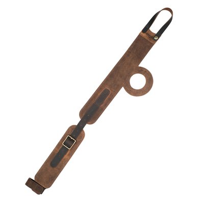 Elevate your ride with the Trip Machine Tank Strap, crafted from premium, durable leather that ages beautifully with every journey. Designed for a seamless vertical mount, it fits your tank perfectly while protecting it in style. Fully adjustable straps ensure a custom fit, and a precise fuel cap cutout adds functional elegance. The blend of smooth and waxed leather offers a rugged yet refined look, transforming your tank into a statement piece. Pair it with the Trip Machine utility pouch for secure storage on the bike and versatile use off it. Dimensions are about 63 x 6.5 cm.