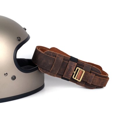 The Trip Machine helmet harness solves a very simple first world motorcycle problem. The annoyance of carrying your helmet in your hand. Its crafted from 2.0 mm heavy duty harness leather that’s soft so that it doesn’t scratch the helmet but heavy duty so you can trust your helmet with it. There is extra padding for the helmet and your shoulders for added comfort and a few additional loops for carrying essentials. It locks using our signature trip machine saddle locks that’s quick and robust. it also allows it to be adjusted according to your height. It’s simple and solves a simple first world motorcycle problem. You can live without it, life is just better with it.