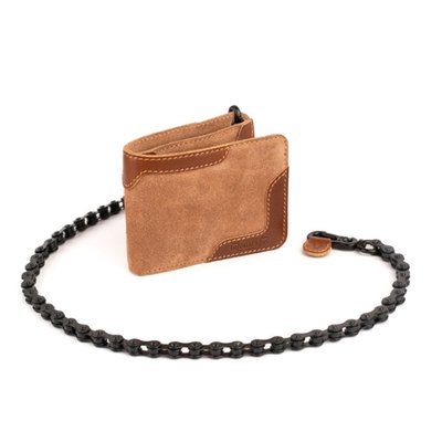 The Trip Machine Rodeo wallet pays homage to the real bad boys before motorcycles replaced horses. Cowboys arguably were the original bikers; the rodeo just had more fun with bikes (or horses). The combination of leather and suede in a wallet is uncommon but fits the description and is sure to be a conversation starter.  The metal moto-chain (69 cm) is removable for days that are more civilized. 