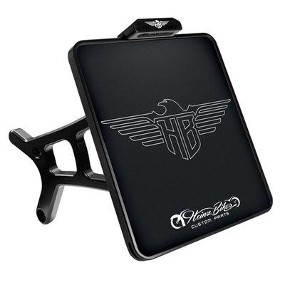 For Austria 210 x 170mm. 
CNC precision machined aluminum construction. With EC approved LED license plate illumination. The HeinzBikes SLIPP-INN 'Screwless' license plate mounting technology allows you to just simply slide the license plate into the holder, without requiring bolts or glue to keep it in place. Sold as kit, complete with all required installation hardware to get the install-job done. 
Note: With approval. Check your local MCS dealer or the MCS sales department for exact type of approval and validity on bike model and years on the test report. 
- Integrated LED license plate light in a slim aluminum housing 
- Slip-Inn license plate mount 
- Strong mount arm with ANTI-TWIST locking mechanism
- Guaranteed anti-twist protection on the swingarm 
- Invisible cable routing on the inside 
- Mounts with 3 different width options 
- Complete with installation hardware 
- CNC machined aluminum