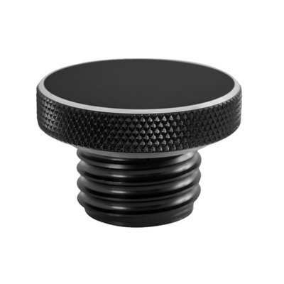 Black 6061-T6 aluminum fuel cap. 
Vented. 
Right hand threaded. 
Knurled for extra grip, for easy on-off with or without gloves. The lower threaded part of the cap has a spring-bound valve system, centrally located in the middle of the bung. This connects to 3 vents in the top part of the cap to allow alleviation of any pressure or vacuum that may build up inside the tank. The O-ring seal, that sits on the top of the thread, offers a secure seal.


