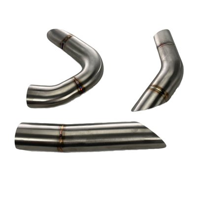 AISI 406 stainless steel with a brushed 'Works' finish, which offers true racing vibes with the clearly visible TIG welds. 
Optional heat shields. 