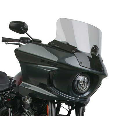 Mount kit included. Light gray, 26% tint. Height: 33.66cm. Width: 44.45cm.
Made of 3mm thick Lexan® polycarbonate with National Cycle's state-of-the-art Quantum+™ Rain Repellent Hard Coating.
National Cycle VStream® replacement windscreens have a unique patented shape. The 'V' profile and dimensional contours push the wind vortex out and away from the rider's helmet, resulting in a peaceful, quieter riding environment. Manufactured from 3mm thick Lexan® polycarbonate with National Cycle's state-of-the-art Quantum+™ Rain Repellent Hard Coating. This is a new generation of polycarbonate hard coating that actually exceeds the hardness and scratch resistance of glass. The surface tension created by the water repellent coating results in water droplets that literally fly off the surface of the windshield at the slightest of angles or wind speeds. It all just got better than ever! Fits as a direct bolt-on High Quality replacement for the OEM style screen. Complete with mount kit.
Note: Center screen height is from the bottom center edge to top of screen.