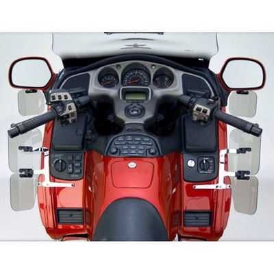 This FRM hardcoated Lexan polycarbonate fairing mount Wing Deflector, medium 50% tinted, allows maximum temperature control of airflow toward or away from the rider. National Cycle's unique Swivel Ratchets allow the Deflector to be incrementally adjusted by hand for personalized temperature control. 
There are no tools required for mounting (mount kit is included), installation is easy. This wing deflector is fully road worthy and, once adjusted, stays in place even at highway speeds. A unique one-piece steel bracket is designed for maximum strength and chrome plated for a beautiful finish.
There are no joints in National Cycle's brackets, so they can not move out of adjustment. The kit consists of 4 pieces.
