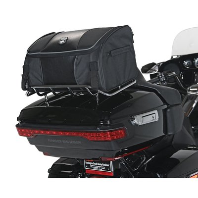 Approx. dimensions: 18" (45.7cm) long x 12" (30.5cm) wide x 10" (25.4cm) high. Capacity approx. 35 liter. Manufactured from Industry leading UltraMax® fabric with a maximum UV protection against fading. A perfect travel bag for on-bike use and transports easily, with the carry handles, once off-bike. Quick release straps securely allows mounting to tour trunks, luggage racks, sissy bars and racks. Fits inside all Harley-Davidson Tour Trunks. Complete with a 100% Waterproof rain cover. Offers a rigid construction with mesh pocket under the lid and a lined interior easily holds a full-face helmet. Reflective piping is used for enhanced visibility.