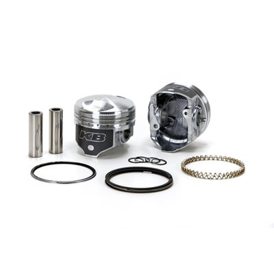 High compression pop-up piston set. 9.5:1 CR. Piston weight 388gr. Piston pin weight 97gr. 
Head type: Dome / Dome -47cc. 
Compression height 1.285" / Bore 3.4980". 
Stroke 4.250". 
Rod length 7.440" / Cyl. length 5.330". 
Comes with T7 heat treated 390 Hypereutectic cast pistons with 16% silicone levels which enables running a very tight clearance for longevity and hardly any piston noise. 

Note: Top compression ring will need additional clearance. See instructions.
Note: Around 30% of stock 1340cc Shovel cylinders may present a problem in combination with the location of some of the oil return holes since KB pistons have a wider piston ring pack for better piston stability in the cylinder. In these cases the oil return hole must be re-located (lowered) to avoid excessive oil consumption.