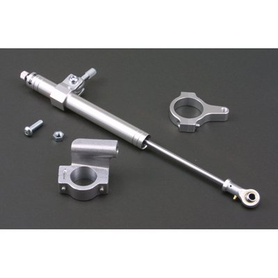With 41mm fork clamp for 41mm fork tubes.
Quality fork damper to increase your ride's stability. Silver anodized aluminum damper. Includes hardware as shown.
Hydraulic steering stabilizers, or fork dampers, offer damping and can give an increase in high speed stability and ultimately help prevent the dreaded speed wobble. Not just for drag or street racers, but regular riding as well.