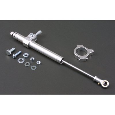 With 39mm fork clamp for 39mm fork tubes.
Quality fork damper to increase your ride's stability. Silver anodized aluminum damper. Includes hardware as shown. Hydraulic steering stabilizers, or fork dampers, offer damping and can give an increase in high speed stability and ultimately help prevent the dreaded speed wobble. Not just for drag or street racers, but regular riding as well.