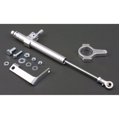 With 41mm fork clamp for 41mm fork tubes.
Quality fork damper to increase your ride's stability. Silver anodized aluminum damper. Includes hardware as shown. Hydraulic steering stabilizers, or fork dampers, offer damping and can give an increase in high speed stability and ultimately help prevent the dreaded speed wobble. Not just for drag or street racers, but regular riding as well.