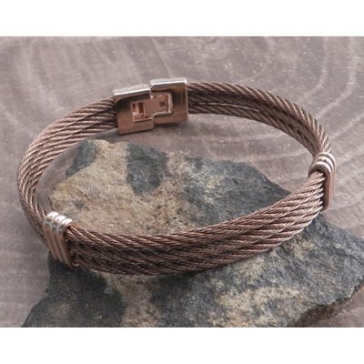 The Amigaz 3-Row Stainless Steel rust bangle with rose gold accent beads and hinge clasp. This bracelet features a stunning rust color finnish. Built to fit an 8" wrist.