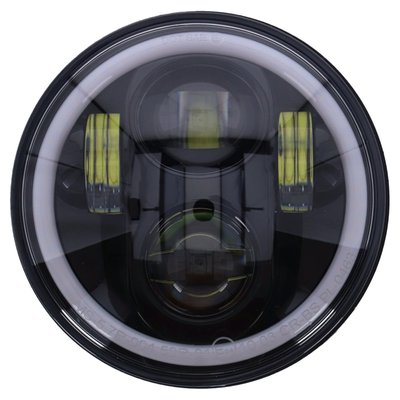 ECE & DOT approved. 
Black bezel. 
With a switchable white/amber (orange) colored halo-ring/position light. 
Economical high/low beam LED conversion head lamp unit to replace the stock H4 unit. 
LEDs are an improvement at all levels when compared to H4 lighting and offer more effective and whiter light at 6000K, much better reliability and less amperage draw. 
- White / amber switchable halo-ring/position light 
- Unit comes complete with wiring with a 3-prong plug that is identical to a standard H4 light bulb, allowing a plug & play conversion 
- Compatible with left side (UK) & right side (EU) driving
- 143.8mm (5.66") diameter 
- 88.7mm (3.49") deep 
- 6500K color temperature 
- Theoretical power at high beam 66W 
- 12-Volt DC 
- Passing beam 21W 
- Driving beam 31W 
- Halo ring/position light 60 LEDs 5.2W
- Approval E24*50R01/00*0463*00 

NOTE: Not available for sale in Germany.