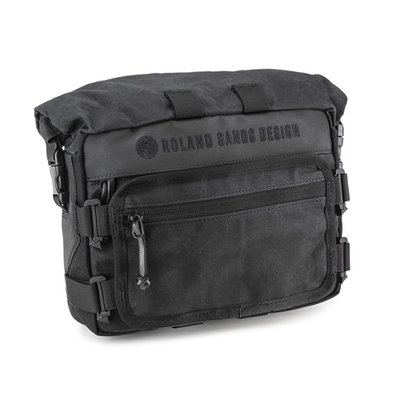 The Roland Sands Design X Kriega Roam Handlebar Bag is ideally suited for cruiser bikes with drag bar or t-bars with high risers, whilst the Velcro® Molle mounting system also enables a variety of other mounting options. Constructed from RSD’s propriety wax cotton together with 1000D Cordura® and super tough hypalon reinforcement to give a classic look with modern technical twist. The main compartment is a roll-top waterproof Drypack, ideal for storing keep dry essentials. A quick access front pocket with dividers and key clip, keep small items to hand. An optional smartphone pocket can be mounted landscape or portrait for navigation with a touch sensitive TPR screen cover or reverse mounted for easy access phone storage. Available in 2 colour options: black or ranger.