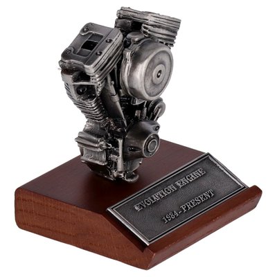 Featuring pewter construction on a wooden display base. Base Height: 2-3/4" Base Width: 2-3/4" Total Height: 3-1/4"