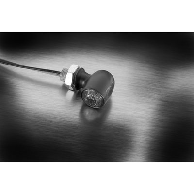 Dark lens. 
Black housing. 
Orange Light.
With an overall length of 14mm a maximum diameter of 10mm with a lens diameter of just 7.8mm the Spot is an extremely small turn signal with a high quality metal housing. Where some small lower cost turn signals may make safely navigating through through traffic a challenge. Not so with the Spot, of which the High Output power LED in combination with the special Extranz Extreme Optical Transparency technology actually gives it a colossal light output compared to its size. Highly visible, only when lighted, in any day or night circumstance. With M5 x 6.5mm threads.
- ECE approved for front & rear 
- EXtranz® - Extreme Optical Transparency Technology 
- Kellermann HighPower LED Technology 
- Longlife Protection Guard®, IC operated, 330 kHz
- High quality metal housing 
- Suitable for 12 volt DC applications 
- M5x0.5x6.5 threaded 
- Dimensions: Length 14mm, max. diameter 10mm, lens diameter 7,8mm 
- European design protection 