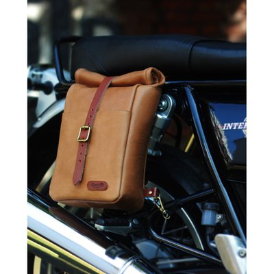 This very small backpack is a high quality hand made build that is ready for dual use, on your back or as saddlebag. Made completely from 100% Heavy Duty leather and 0% compromise. Made for years of use and the looks get better with every trip. Designed to be easy on/off install on the motorcycle in a matter of seconds. A backpack for true everyday use. The classic roll-top design provides additional flexibility. 
Identical to the 15 liter version (995611 tobacco, 995612 black), but just a 1/3 of the size. Complete with a shoulder strap for when off-bike. 
Approx. dimensions: 10" (25cm) x 7" (18cm) x 3" (7.5cm) (with roll-top rolled). 
Approx. Capacity: 3.3 liter. 