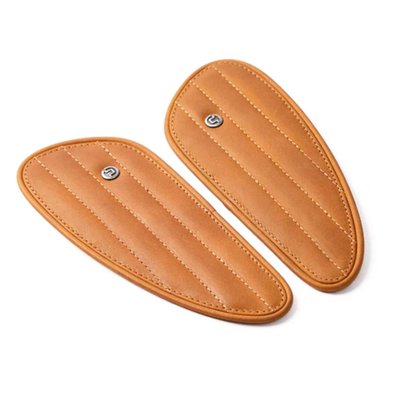 Handmade leather fuel tank pad set. Designed to replace standard tank pads or use them in other custom applications to enhance the visual appeal of your bike. Handmade from signature Trip Machine's crunch (extra subtle) genuine leather. These will last well when maintained. Comes with industrial standard 3M tape installed to ensure the tank pads that will not damage your motorcycle paint and stay in place. Sold as a left & right set.
Dimensions: 18.5cm long x 7.5cm high x 0.8cm thick.
Note: Old rubber pads can be removed by applying moderate heat so the glue will get soft and the pad can be removed. Take your time. When applying too much heat paint or pads may be damaged. Contact a professional when in doubt.