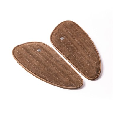 Handmade leather fuel tank pad set. Designed to replace standard tank pads or use them in other custom applications to enhance the visual appeal of your bike. Handmade from signature Trip Machine's crunch (extra subtle) genuine leather. These will last well when maintained. Comes with industrial standard 3M tape installed to ensure the tank pads that will not damage your motorcycle paint and stay in place. Sold as a left & right set.
Dimensions: 18.5cm long x 7.5cm high x 0.8cm thick.
Note: Old rubber pads can be removed by applying moderate heat so the glue will get soft and the pad can be removed. Take your time. When applying too much heat paint or pads may be damaged. Contact a professional when in doubt.