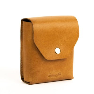 The Trooper is the old school solution to the problem; 'How do I carry my helmet when off the bike?' It comes as a leather carrying case that contains the actual helmet bag. The carrying case can be mounted to the bike, most (saddle) bags or to your belt. When you need the helmet bag, take it out and stuff your helmet inside. It will take both jet and most full face helmets. The helmet bag is a sturdy construction, equipped with carrying straps, crafted from high-quality unbleached cotton and accented with premium leather trim. This Trooper helmet bag ensures that your helmet stays safe from scratches, scuffs, and other potential damages. The unbleached cotton material is breathable and gentle on your helmet's exterior. A convenient and accessible accessory for your travels. 