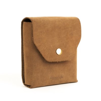 The Trooper is the old school solution to the problem; 'How do I carry my helmet when off the bike?' It comes as a leather carrying case that contains the actual helmet bag. The carrying case can be mounted to the bike, most (saddle) bags or to your belt. When you need the helmet bag, take it out and stuff your helmet inside. It will take both jet and most full face helmets. The helmet bag is a sturdy construction, equipped with carrying straps, crafted from high-quality unbleached cotton and accented with premium leather trim. This Trooper helmet bag ensures that your helmet stays safe from scratches, scuffs, and other potential damages. The unbleached cotton material is breathable and gentle on your helmet's exterior. A convenient and accessible accessory for your travels. 