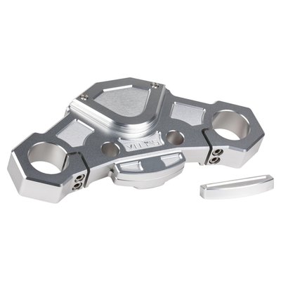 Silver anodized finish.
Without steering lock.
Direct upgrade replacement for the stock upper (top) triple tree fork clamp. CNC machined from one piece of billet aluminum in the recognizable Vity's Design style. This top clamp is better flex resistant and offers superior strength with an overall reduction in weight. A direct fit for the stock 49mm forks. A perfect base for a front end upgrade and perfect to combine with other style matching Vity's Design products.