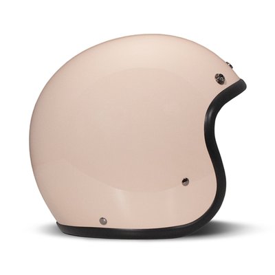 Embrace the fusion of classic style and modern functionality with the DMD Retro helmet, a nod to the iconic 70's design. This helmet isn't just a protective gear but a statement piece, crafted for those who dare to stand out. With its ECE 22.06 approved fiberglass shell available in three sizes, it offers a snug fit. The helmet is bluetooth ready, features integrated snaps for visors, and boasts a luxurious, washable lining with Velcro for a custom fit. Secured with a padded chin strap and a reliable Double D-ring closure, this helmet is the perfect blend of vintage charm and contemporary comfort.