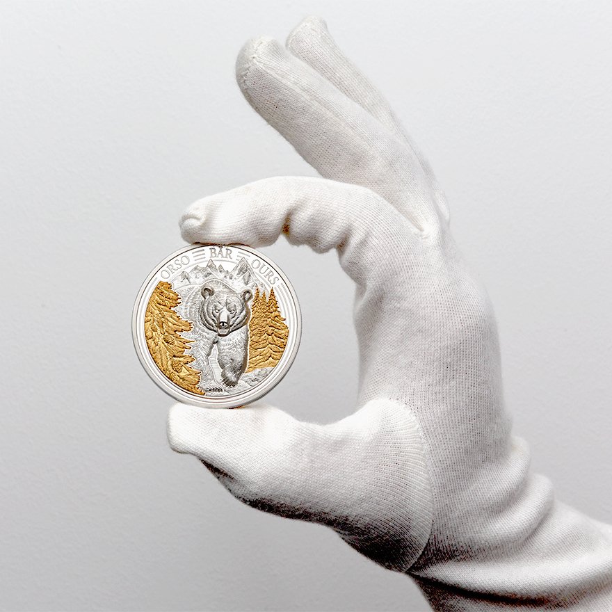 Front View (coin held in gloves) of the Silver Swiss Wildlife - Bear 3 oz PP - Ultra High Relief 2025